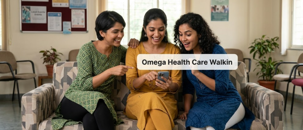 Three young Indian women in salwars excitedly looking at a smartphone notification for the Omega Healthcare Walk-in Drive 2026 for International Voice Process roles in Chennai.